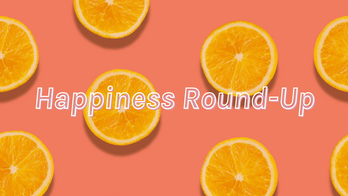 A pink background with slices of yellow lemon and text that says "Happiness Round-Up".